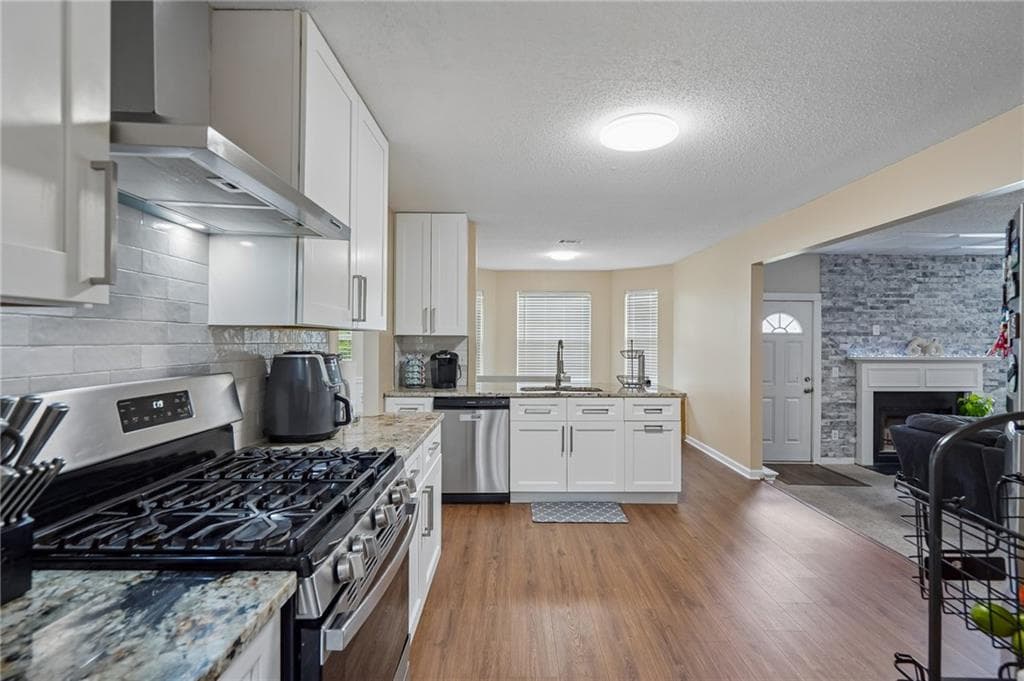 4 bedroom, 3 bathroom, 2,631 sq ft single family residence for sale at 6612 Pamplona Place, Atlanta, GA 30349 — photo 7