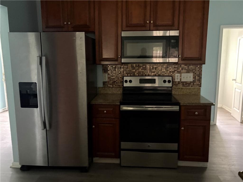 3 bedroom, 3 bathroom, 1,680 sq ft single family residence for sale at 5074 Windsor Forrest Lane, Atlanta, GA 30349 — photo 4