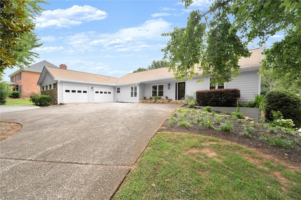 6 bedroom, 3 bathroom, 4,820 sq ft single family residence for sale at 560 Saddle Creek Circle, Roswell, GA 30076