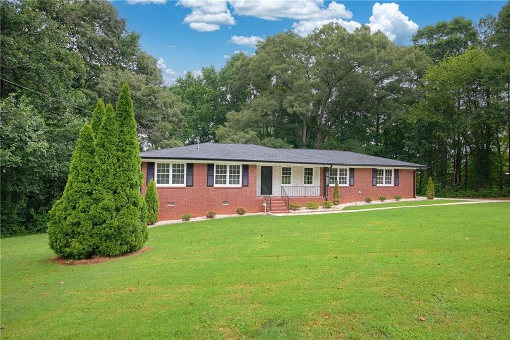 4 bedroom, 3 bathroom, 1,448 sq ft single family residence for sale at 1502 Kings Road, Marietta, GA 30062 — photo 1 of 38