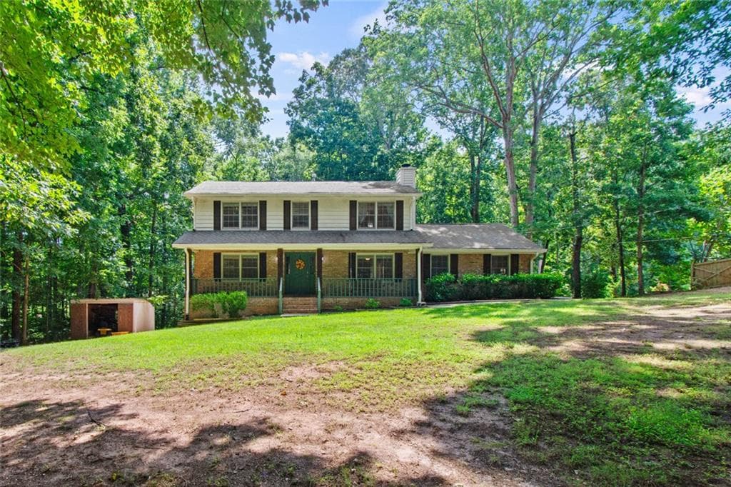 4 bedroom, 3 bathroom, 2,732 sq ft single family residence for sale at 1873 RAINTREE Court, Snellville, GA 30078 — photo 1 of 54