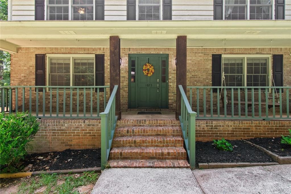 4 bedroom, 3 bathroom, 2,732 sq ft single family residence for sale at 1873 RAINTREE Court, Snellville, GA 30078 — photo 2