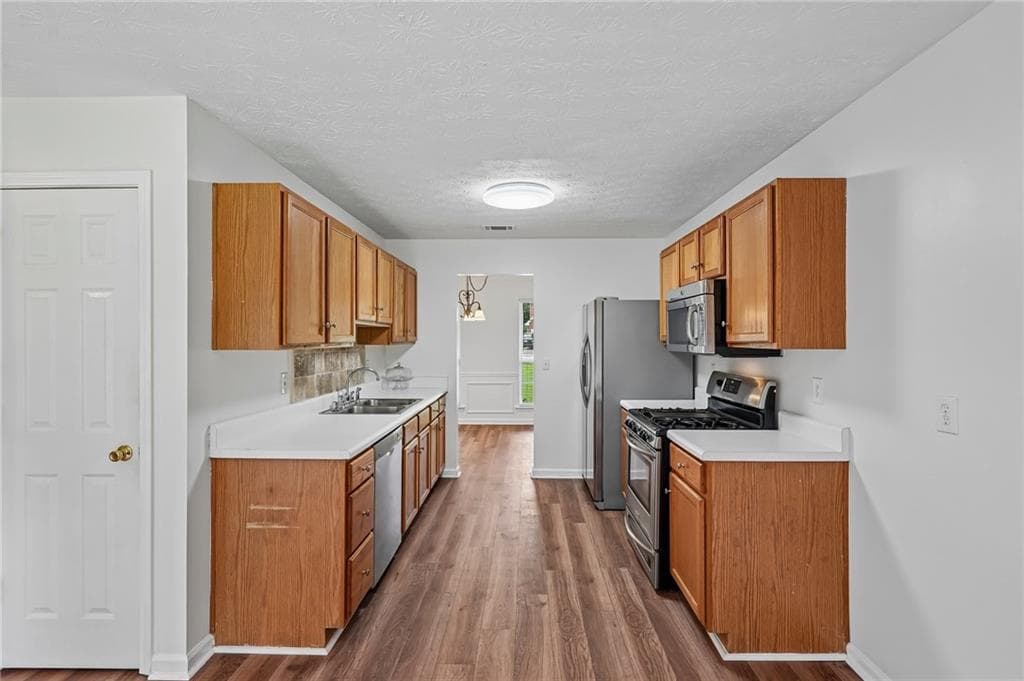 4 bedroom, 3 bathroom, 2,210 sq ft single family residence for sale at 5790 Woodstone Drive, Cumming, GA 30028 — photo 7