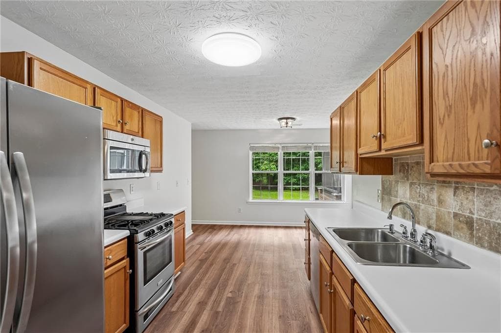 4 bedroom, 3 bathroom, 2,210 sq ft single family residence for sale at 5790 Woodstone Drive, Cumming, GA 30028 — photo 8