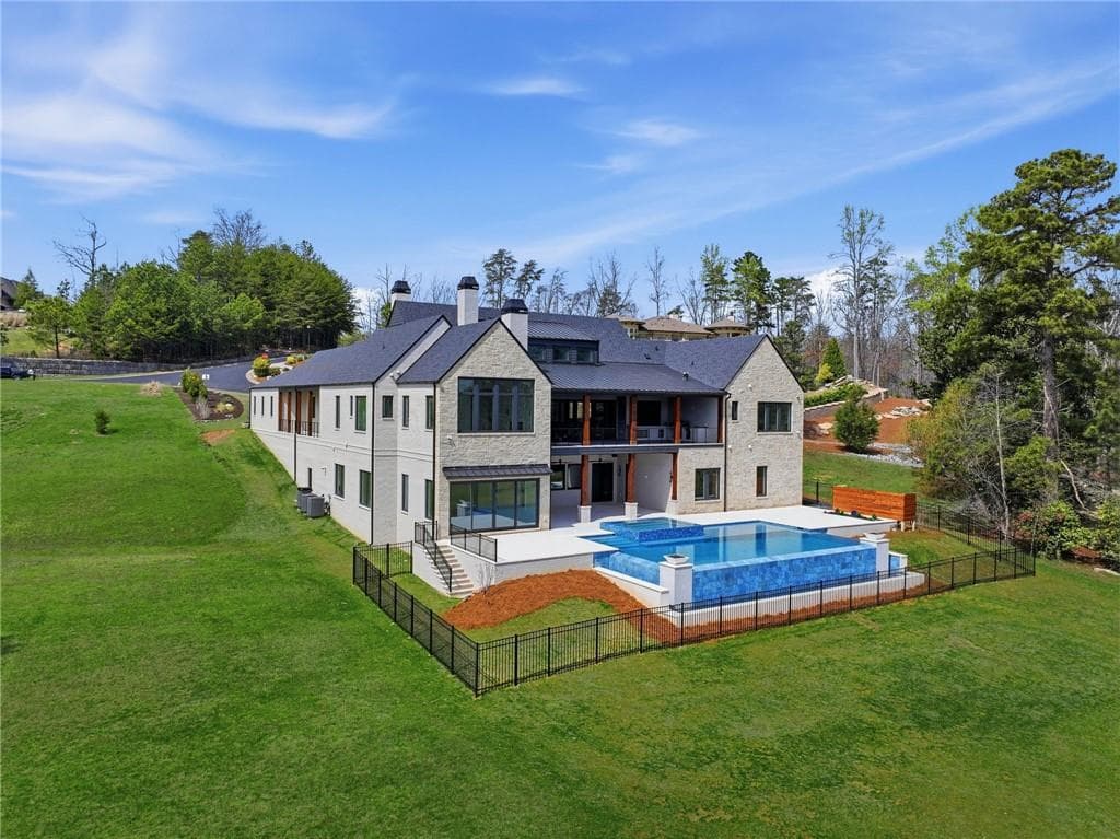 4 bedroom, 6 bathroom, 7,470 sq ft single family residence for sale at 8510 Blue Heron Drive, Gainesville, GA 30506 — photo 2