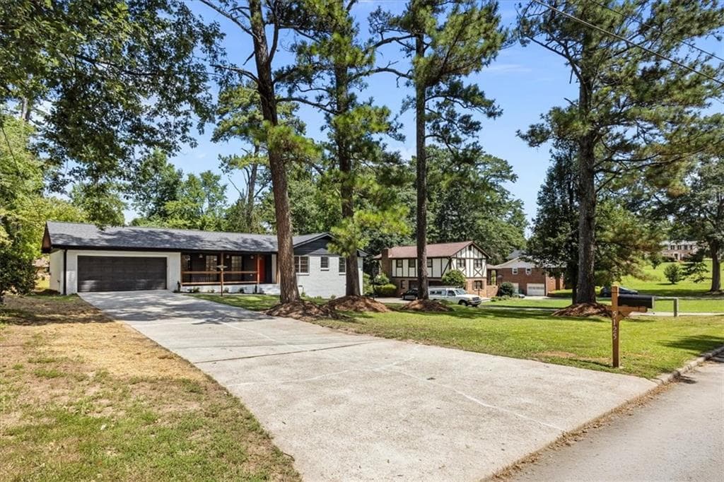 4 bedroom, 3 bathroom, 1,688 sq ft single family residence for sale at 5125 Flakes Mill Road, Ellenwood, GA 30294 — photo 2