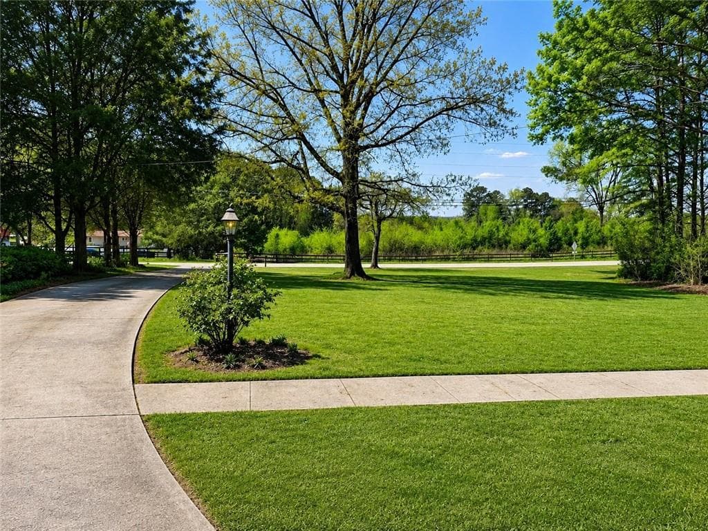 4 bedroom, 3 bathroom, 1,920 sq ft single family residence for sale at 3418 Johnson Drive, Snellville, GA 30039 — photo 2