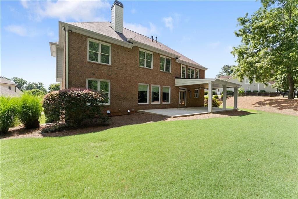 6 bedroom, 5 bathroom, 6,532 sq ft single family residence for sale at 6120 Briarpatch Court, Cumming, GA 30040 — photo 8