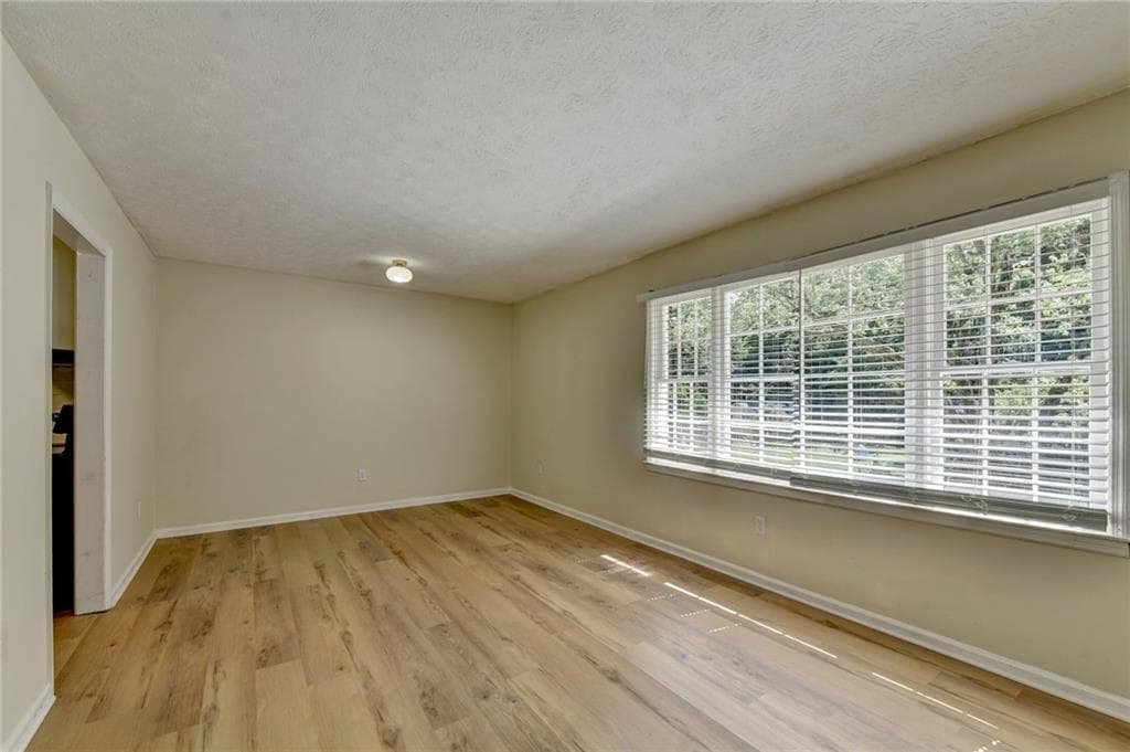 5 bedroom, 3 bathroom, 2,600 sq ft single family residence for sale at 298 W Wind Drive, Lilburn, GA 30047 — photo 4