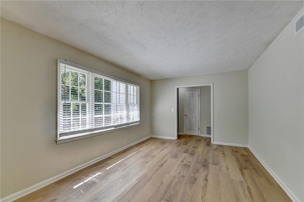 5 bedroom, 3 bathroom, 2,600 sq ft single family residence for sale at 298 W Wind Drive, Lilburn, GA 30047 — photo 5