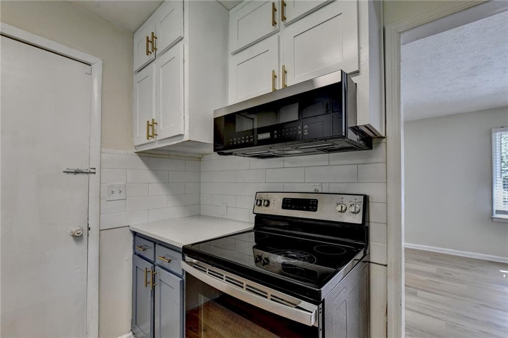 5 bedroom, 3 bathroom, 2,600 sq ft single family residence for sale at 298 W Wind Drive, Lilburn, GA 30047 — photo 10