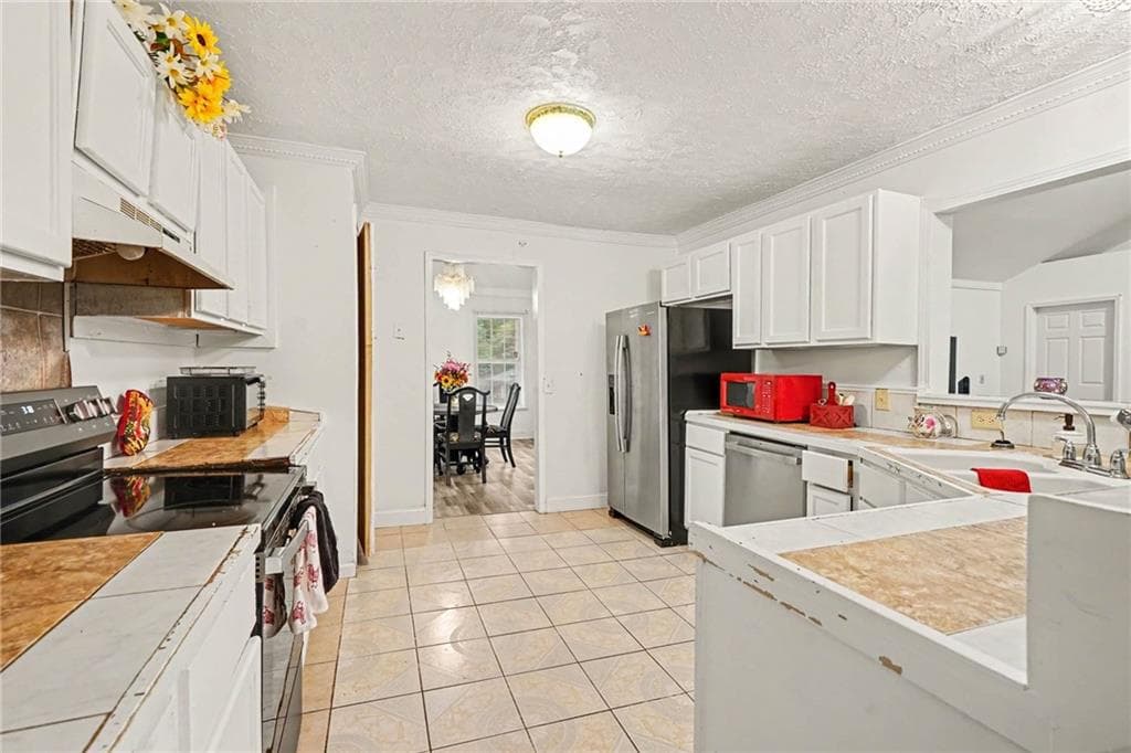 4 bedroom, 3 bathroom, 2,649 sq ft single family residence for sale at 5667 Miller Grove Road, Lithonia, GA 30058 — photo 9