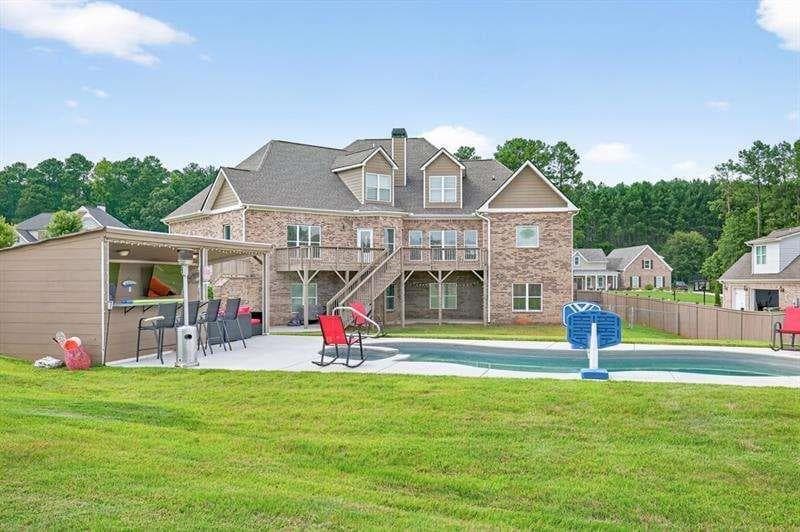 4 bedroom, 5 bathroom, 5,761 sq ft single family residence for sale at 2112 Meadowood Cove, Monroe, GA 30655 — photo 2