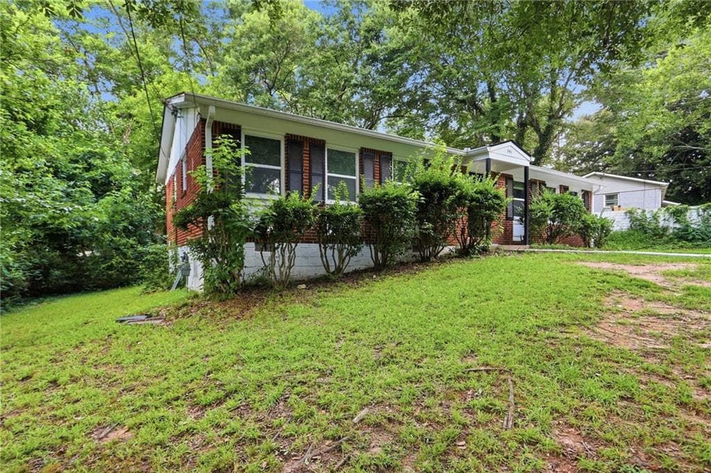3 bedroom, 1 bathroom, 1,225 sq ft single family residence for sale at 341 Roxbury Drive, Riverdale, GA 30274 — photo 2