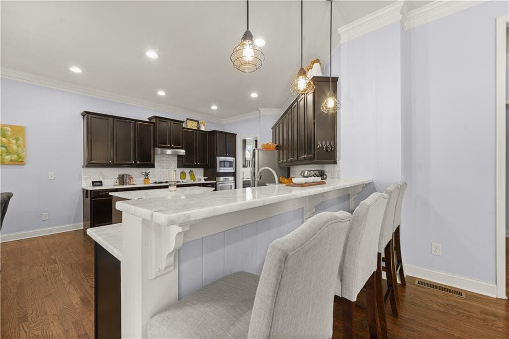 6 bedroom, 5 bathroom, 5,240 sq ft single family residence for sale at 11880 Old Station Place, Alpharetta, GA 30004 — photo 6