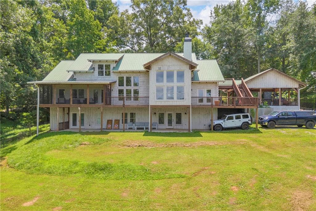 4 bedroom, 5 bathroom, 5,086 sq ft single family residence for sale at 2865 Hightower Road, Ball Ground, GA 30107 — photo 2