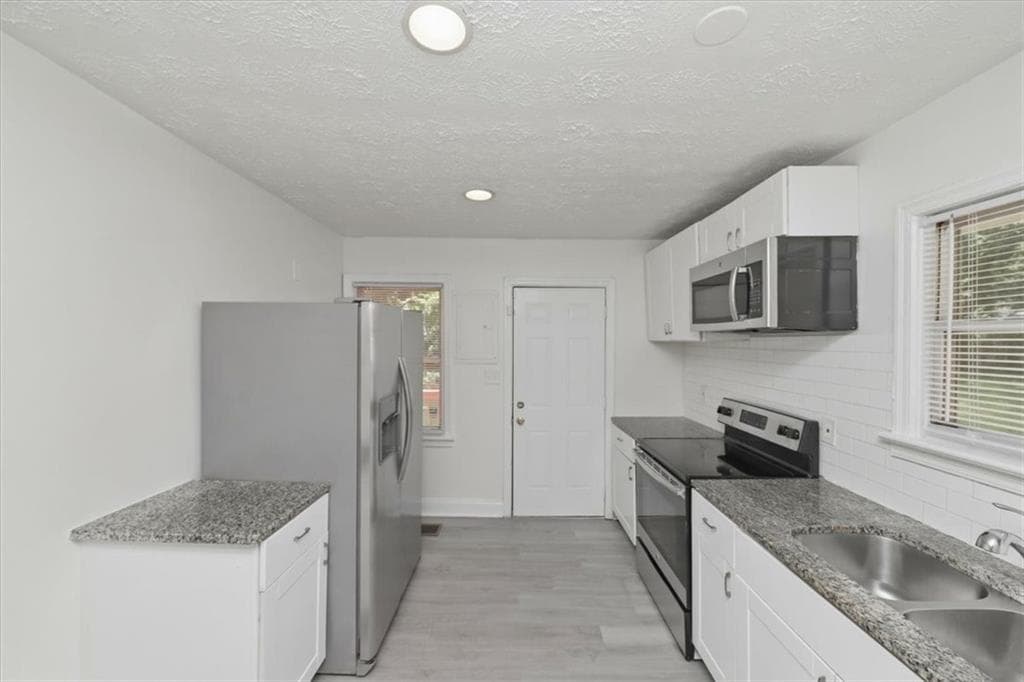 3 bedroom, 2 bathroom, 1,106 sq ft single family residence for sale at 2153 Burroughs Avenue, Atlanta, GA 30315 — photo 5
