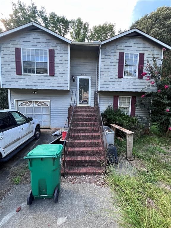 4 bedroom, 2 bathroom, 1,136 sq ft single family residence for sale at 5568 Bradley Circle, Lithonia, GA 30038 — photo 1 of 12