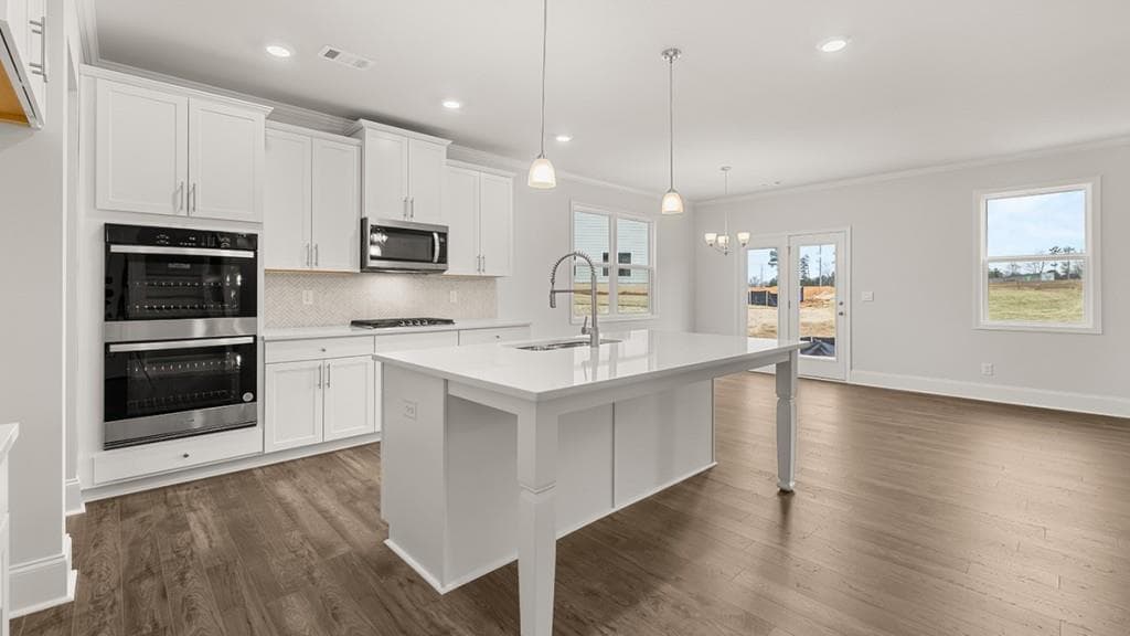 4 bedroom, 3 bathroom, 3,106 sq ft single family residence for sale at 7165 Bocholt Drive, South Fulton, GA 30349 — photo 4