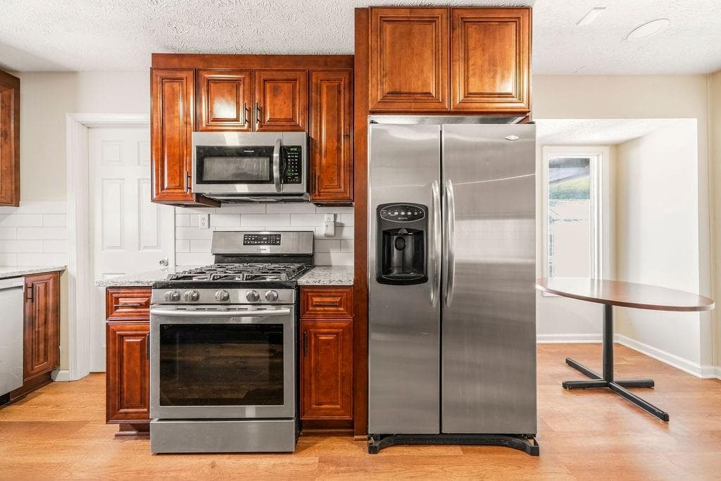 4 bedroom, 3 bathroom, 2,000 sq ft single family residence for sale at 3755 Station Drive, Kennesaw, GA 30144 — photo 7