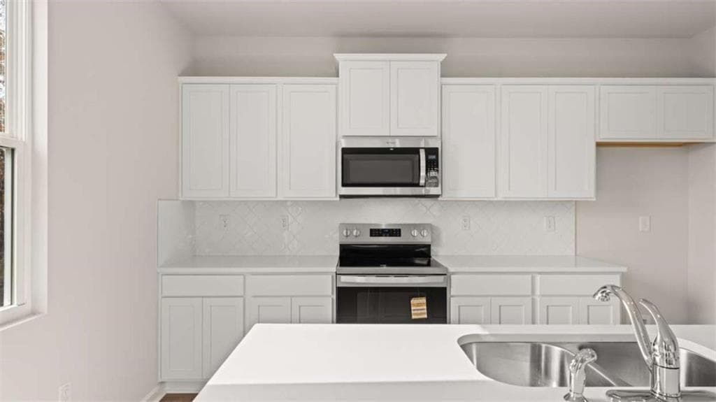 4 bedroom, 3 bathroom, 2,338 sq ft single family residence for sale at 309 Faulkner Street, Stockbridge, GA 30281 — photo 6