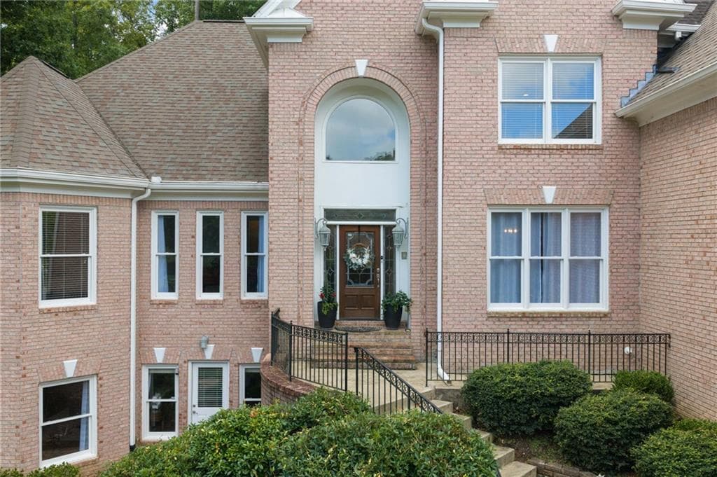 6 bedroom, 6 bathroom, 6,896 sq ft single family residence for sale at 8240 Royal Troon Drive, Duluth, GA 30097 — photo 2