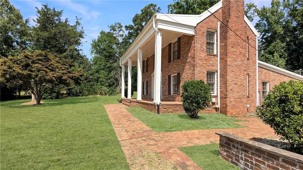 3 bedroom, 2 bathroom, 2,304 sq ft single family residence for sale at 7855 Rivertown Road, Fairburn, GA 30213 — photo 2