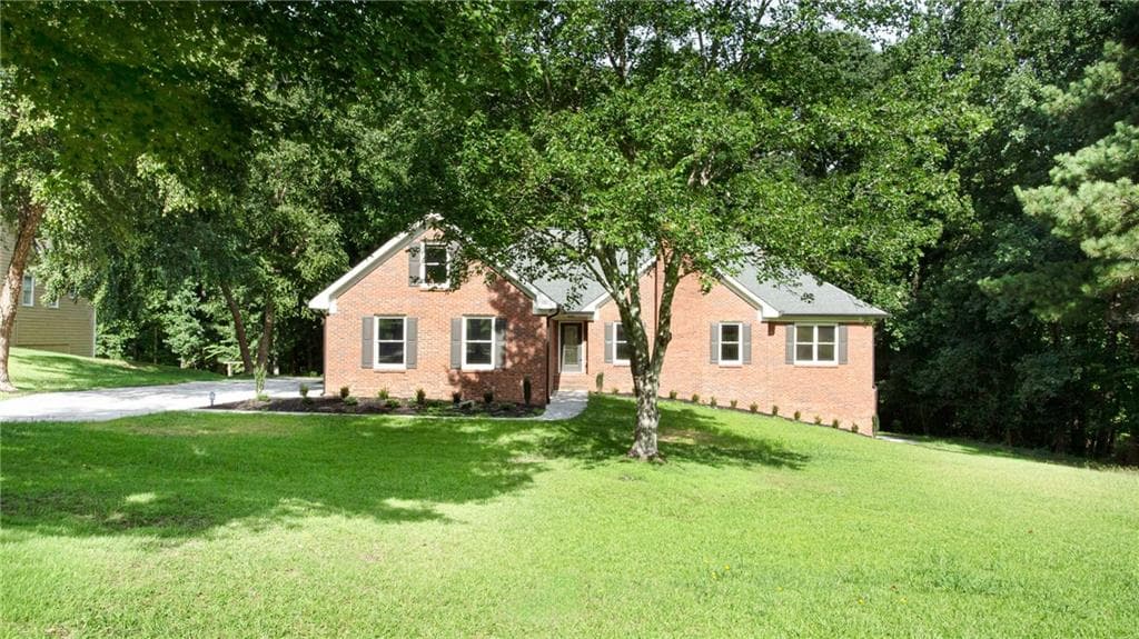 3 bedroom, 2 bathroom, 2,131 sq ft single family residence for sale at 1055 Windridge Drive, Loganville, GA 30052 — photo 1 of 52