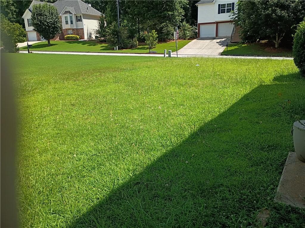 4 bedroom, 3 bathroom, 2,435 sq ft single family residence for sale at 5714 Flowers Ridge Road, Powder Springs, GA 30127 — photo 2