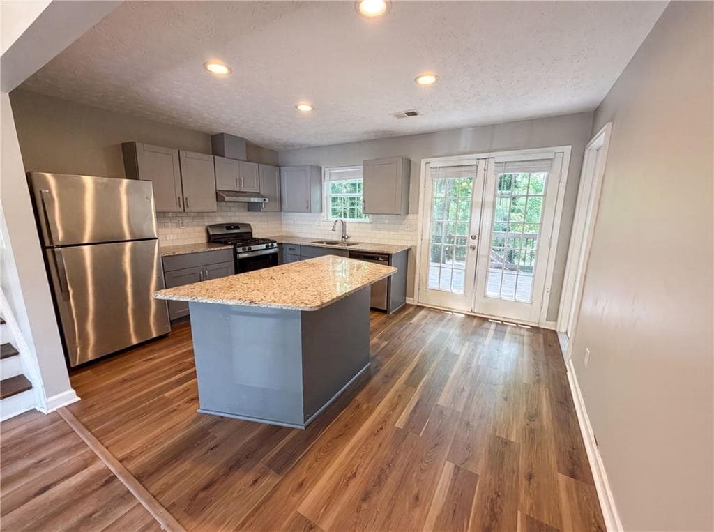 3 bedroom, 2 bathroom, 1,320 sq ft single family residence for sale at 5067 Redan Road, Stone Mountain, GA 30088 — photo 2