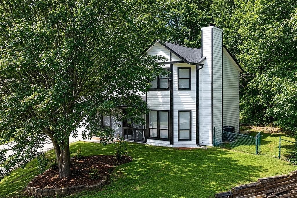 4 bedroom, 3 bathroom, 1,568 sq ft single family residence for sale at 556 Sunfield Drive, Lilburn, GA 30047