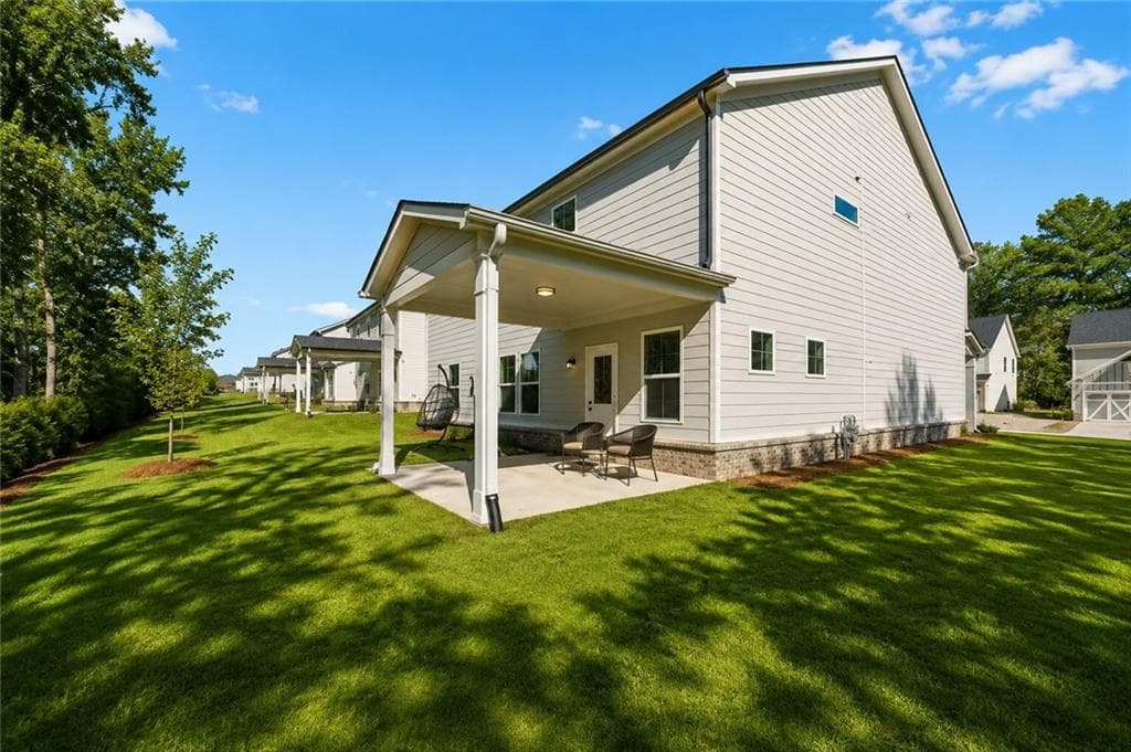 5 bedroom, 3 bathroom, 3,058 sq ft single family residence for sale at 1612 Tide Mill Road, Cumming, GA 30040 — photo 2