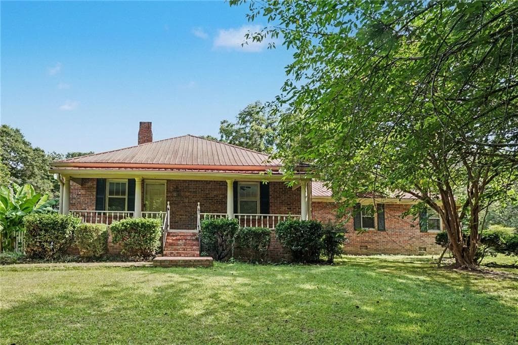 3 bedroom, 2 bathroom, 1,946 sq ft single family residence for sale at 2021 W Hightower Trail, Conyers, GA 30012 — photo 1 of 46