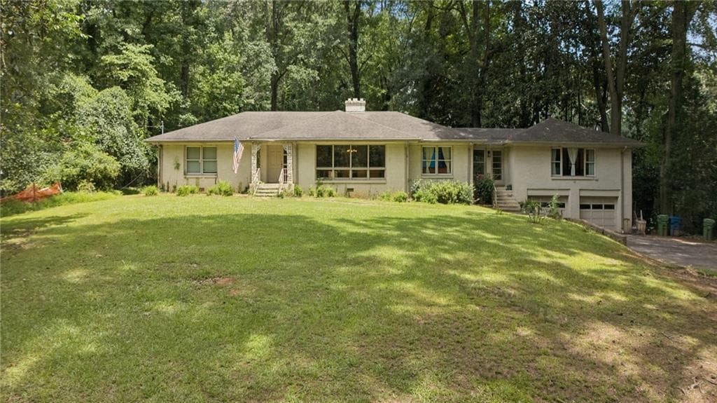 4 bedroom, 3 bathroom single family residence for sale at 1191 W Wesley Road, Atlanta, GA 30327 — photo 1 of 18