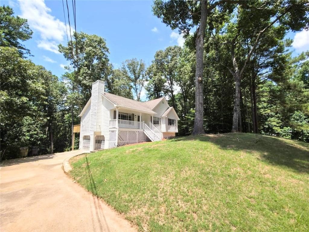 4 bedroom, 2 bathroom, 1,328 sq ft single family residence for sale at 1436 Towne Harbor Lane, Woodstock, GA 30189 — photo 2