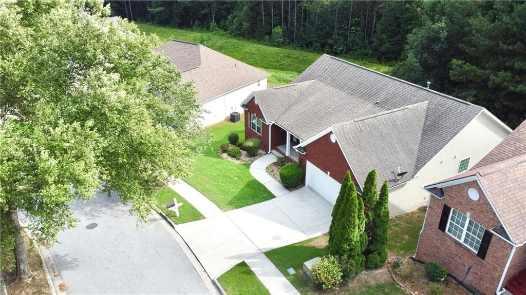 5 bedroom, 3 bathroom, 3,660 sq ft single family residence for sale at 4081 Savannah Ridge Trace, Loganville, GA 30052 — photo 4
