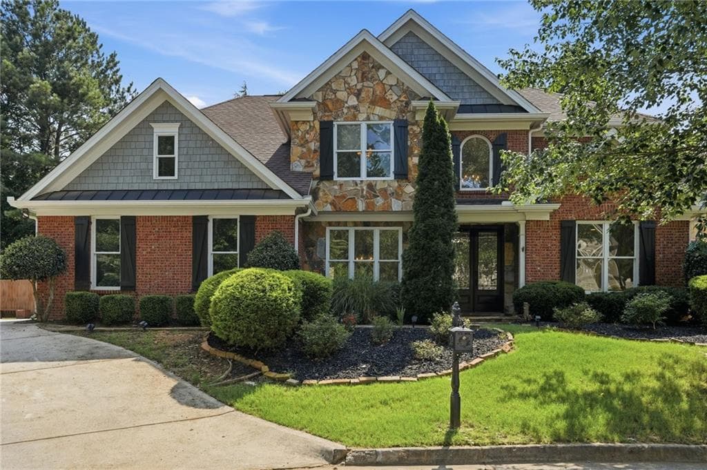 5 bedroom, 4 bathroom, 3,188 sq ft single family residence for sale at 1335 Whisper Cove Drive, Buford, GA 30518 — photo 2