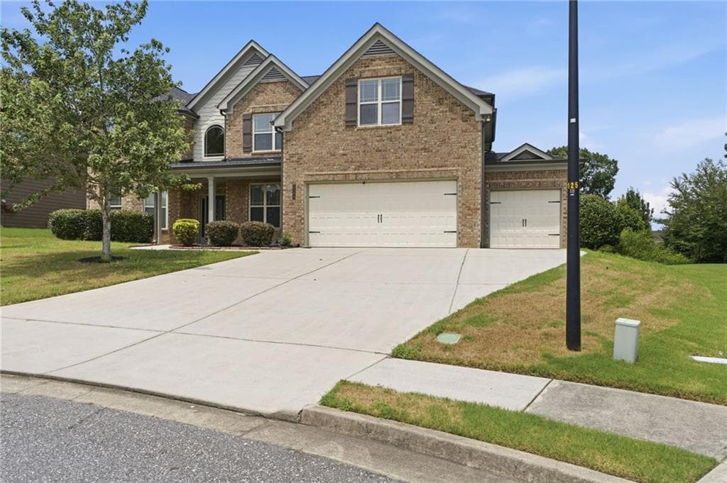 5 bedroom, 4 bathroom, 3,956 sq ft single family residence for sale at 1283 Skipping Stone Court, Dacula, GA 30019 — photo 2