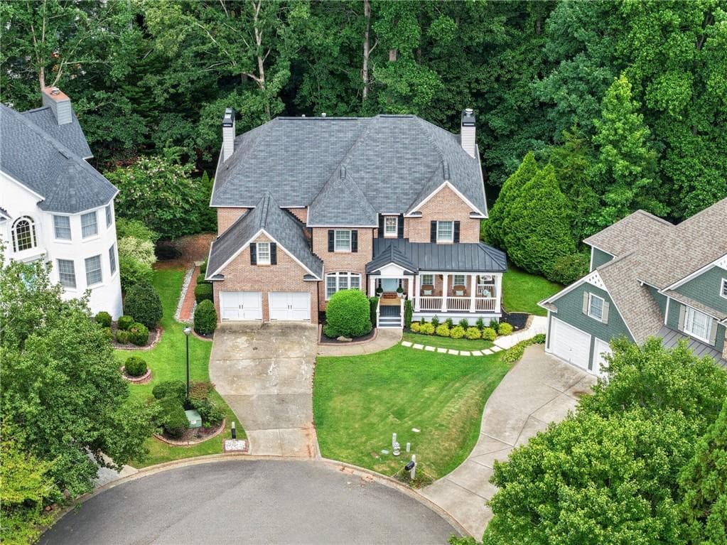 5 bedroom, 4 bathroom, 4,156 sq ft single family residence for sale at 6425 Stream Side Court, Cumming, GA 30041 — photo 3