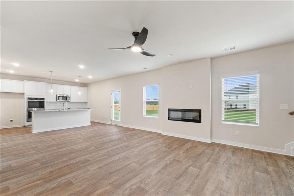 4 bedroom, 3 bathroom, 2,700 sq ft single family residence for sale at 719 CONEFLOWER Way, Mcdonough, GA 30253 — photo 5