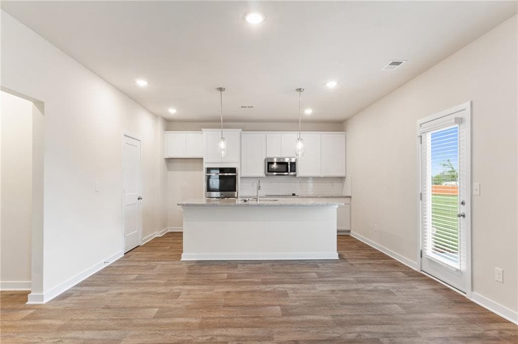 4 bedroom, 3 bathroom, 2,700 sq ft single family residence for sale at 719 CONEFLOWER Way, Mcdonough, GA 30253 — photo 6