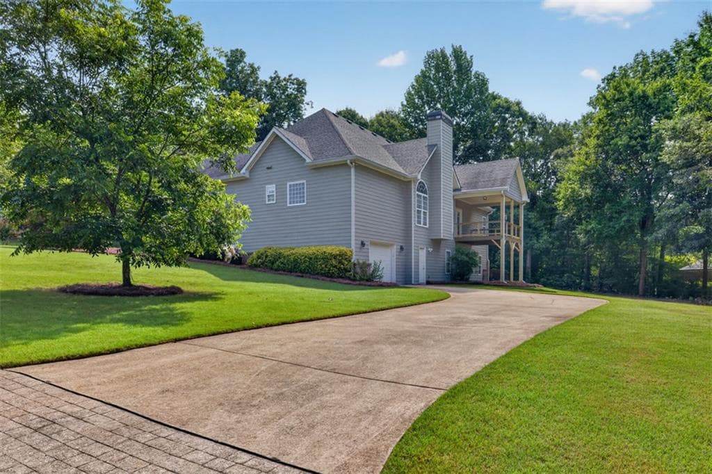 4 bedroom, 3 bathroom, 3,875 sq ft single family residence for sale at 1403 Lull Water Court, Hoschton, GA 30548 — photo 4