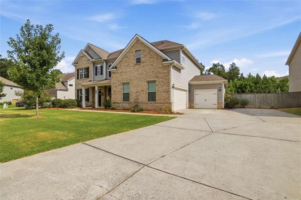 4 bedroom, 3 bathroom, 3,220 sq ft single family residence for sale at 7420 Ansley Park Way, Cumming, GA 30028 — photo 4