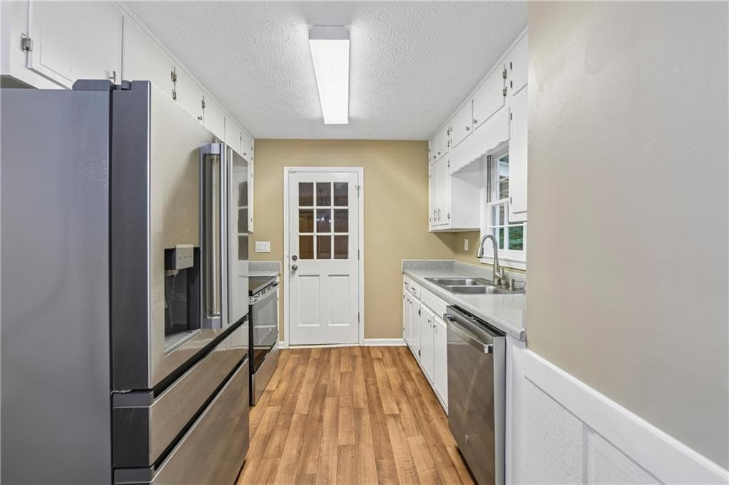 4 bedroom, 3 bathroom, 1,720 sq ft single family residence under contract at 714 Continental Drive, Lawrenceville, GA 30044 — photo 2