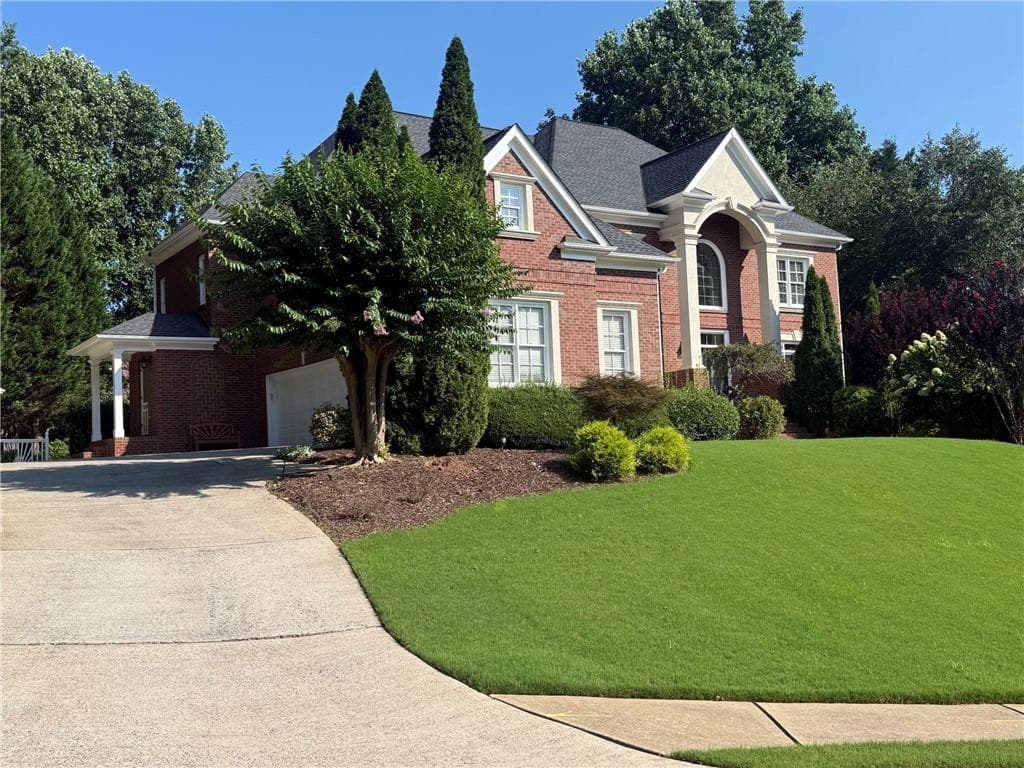 6 bedroom, 7 bathroom, 6,420 sq ft single family residence for sale at 2120 Falling Water Court, Cumming, GA 30041 — photo 2