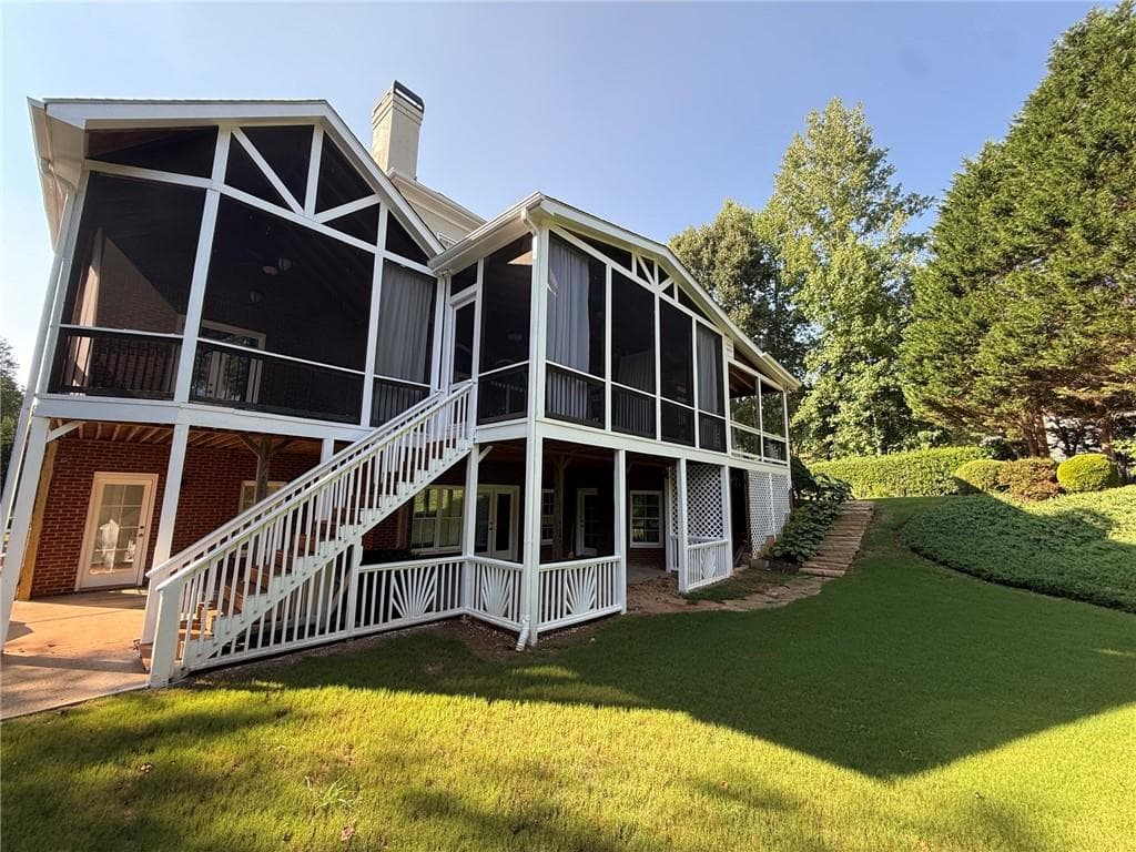 6 bedroom, 7 bathroom, 6,420 sq ft single family residence for sale at 2120 Falling Water Court, Cumming, GA 30041 — photo 5