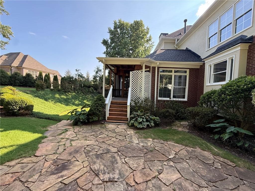 6 bedroom, 7 bathroom, 6,420 sq ft single family residence for sale at 2120 Falling Water Court, Cumming, GA 30041 — photo 6