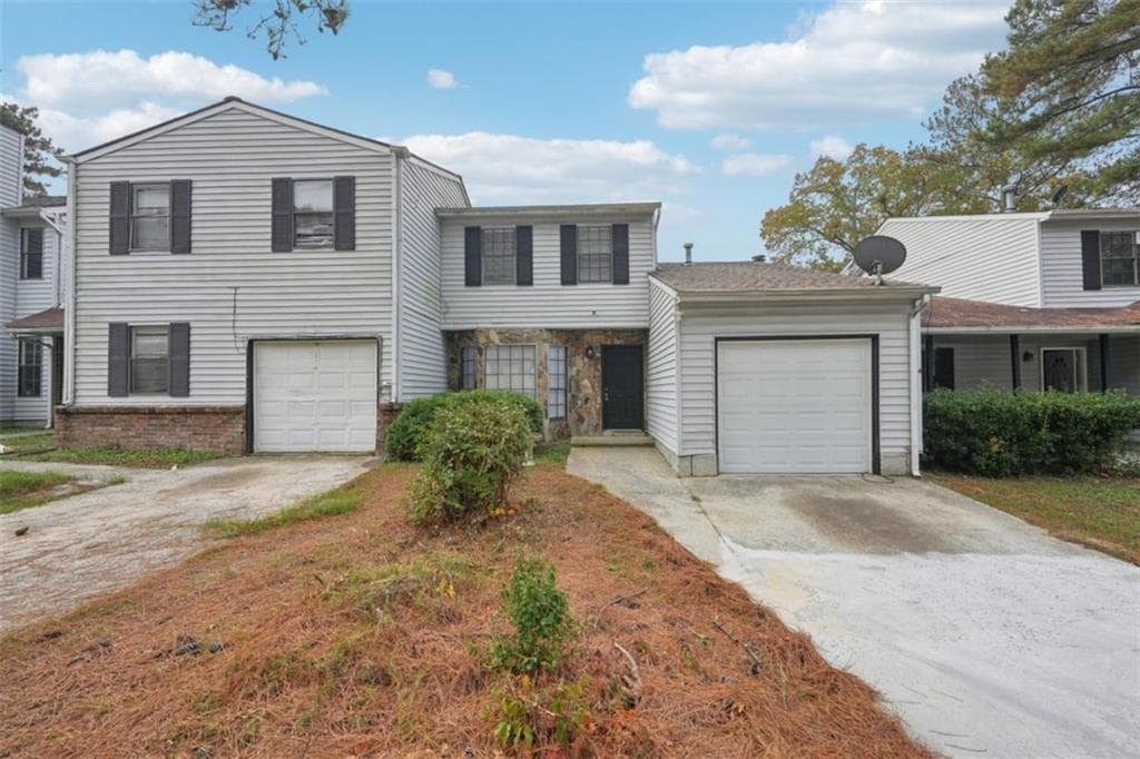 3 bedroom, 2 bathroom, 1,466 sq ft townhouse for sale at 703 Pine Tree Trail, Atlanta, GA 30349 — photo 1 of 22