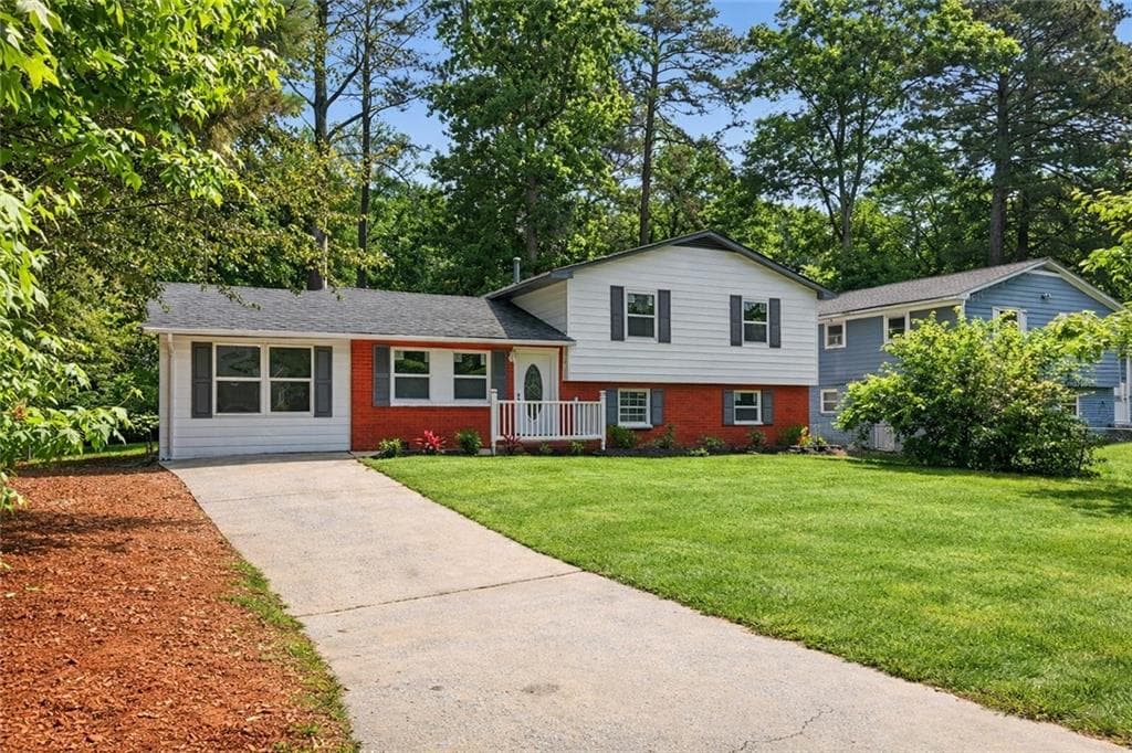 6 bedroom, 3 bathroom single family residence for sale at 7348 Mockingbird Trail, Riverdale, GA 30274 — photo 2