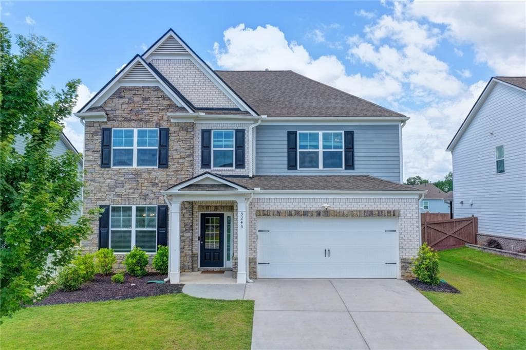 4 bedroom, 3 bathroom, 3,229 sq ft single family residence for sale at 5245 Sargent Drive, Cumming, GA 30040 — photo 2